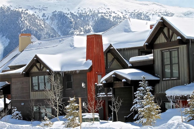 30 Union Creek Trl Bldg 2 # 201, Copper Mountain, CO 80443 - view of snow covered exterior featuring a chimney