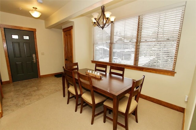 30 Union Creek Trl Bldg 2 # 201, Copper Mountain, CO 80443 - dining area with baseboards, light carpet, and an inviting chandelier
