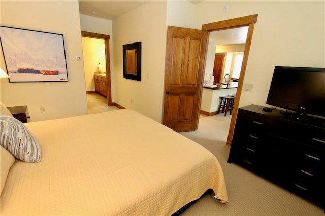 30 Union Creek Trl Bldg 2 # 201, Copper Mountain, CO 80443 - bedroom with baseboards, light carpet, and ensuite bathroom