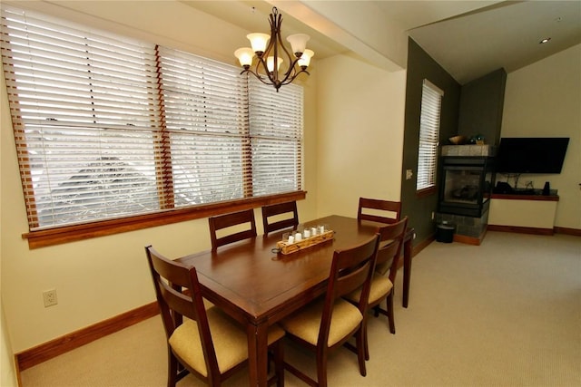 30 Union Creek Trl Bldg 2 # 201, Copper Mountain, CO 80443 - carpeted dining area with a fireplace, baseboards, and an inviting chandelier