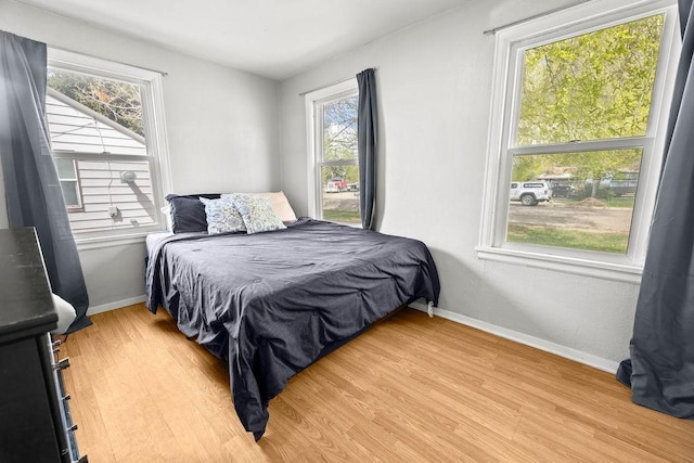 410 Washington St, Craig, CO 81625 - bedroom with light wood-style flooring and baseboards