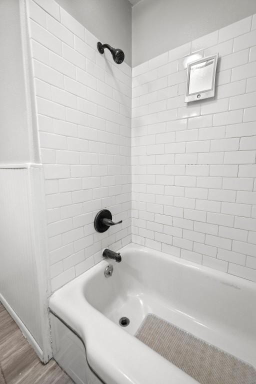 410 Washington St, Craig, CO 81625 - full bathroom featuring wood finished floors and shower / bath combination