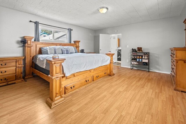410 Washington St, Craig, CO 81625 - bedroom featuring light wood-style flooring and washer / dryer