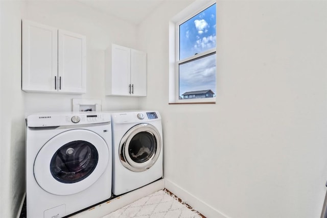 342 Lake View Rd, Hayden, CO 81639 - laundry area featuring baseboards, cabinet space, and independent washer and dryer