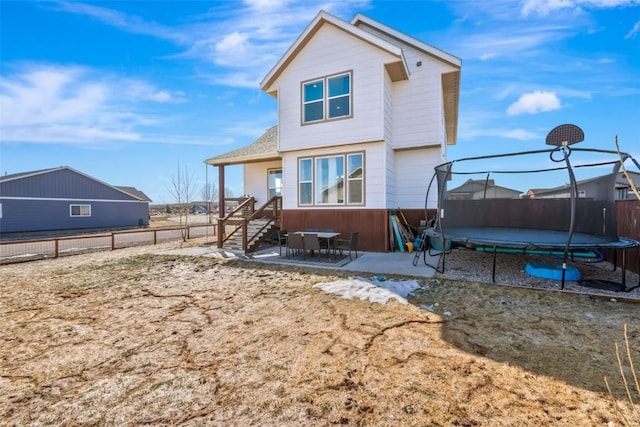 342 Lake View Rd, Hayden, CO 81639 - back of house featuring a patio, a fenced backyard, and a trampoline