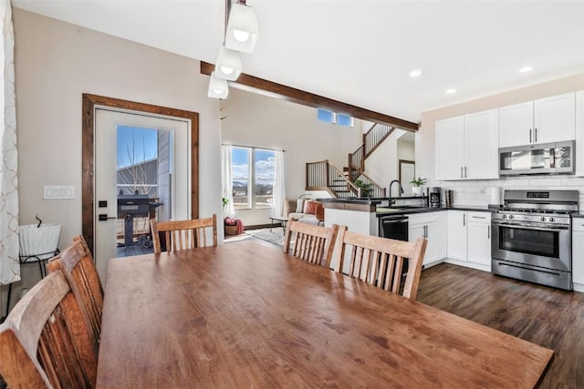 342 Lake View Rd, Hayden, CO 81639 - dining area featuring stairs, recessed lighting, dark wood finished floors, and beam ceiling