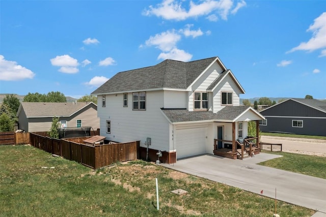 342 Lake View Rd, Hayden, CO 81639 - back of house with concrete driveway, roof with shingles, and a garage