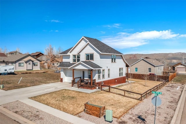 342 Lake View Rd, Hayden, CO 81639 - view of front of property featuring an attached garage, fence, a residential view, and driveway