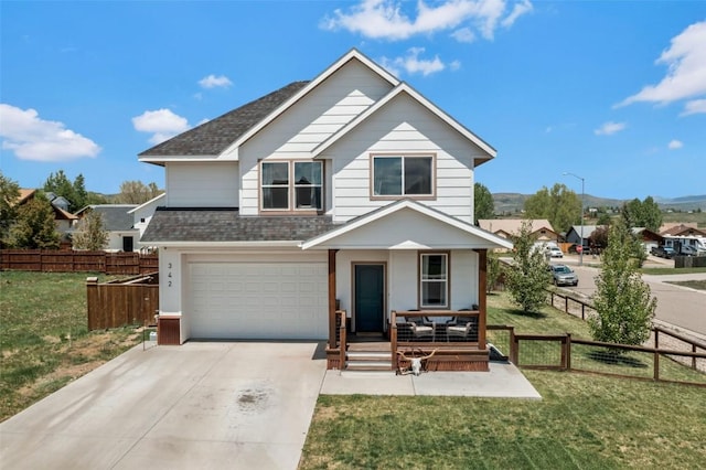 342 Lake View Rd, Hayden, CO 81639 - view of front of property with a shingled roof, concrete driveway, covered porch, an attached garage, and a mountain view