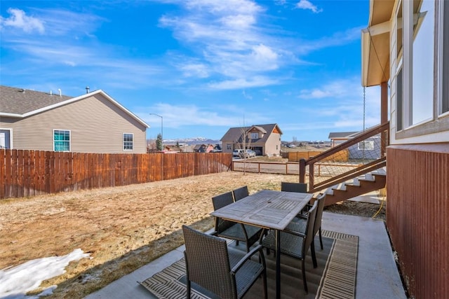 342 Lake View Rd, Hayden, CO 81639 - view of patio featuring outdoor dining area, a fenced backyard, and a residential view