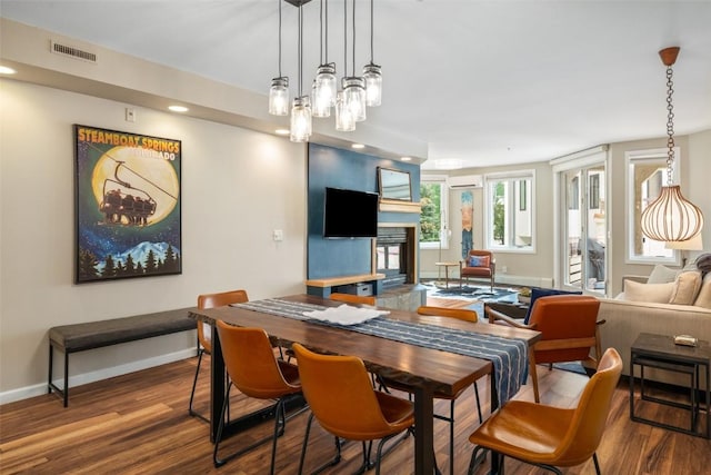 2800 Eagleridge Dr Unit C1, Steamboat Springs, CO 80487 - dining area featuring wood finished floors, recessed lighting, and a multi sided fireplace