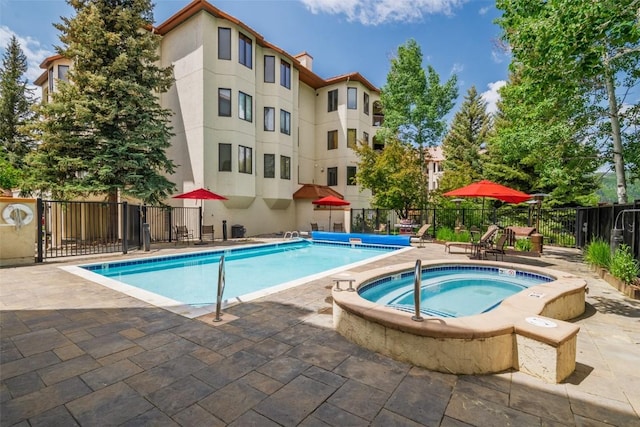 2800 Eagleridge Dr Unit C1, Steamboat Springs, CO 80487 - community pool featuring a patio area and a hot tub