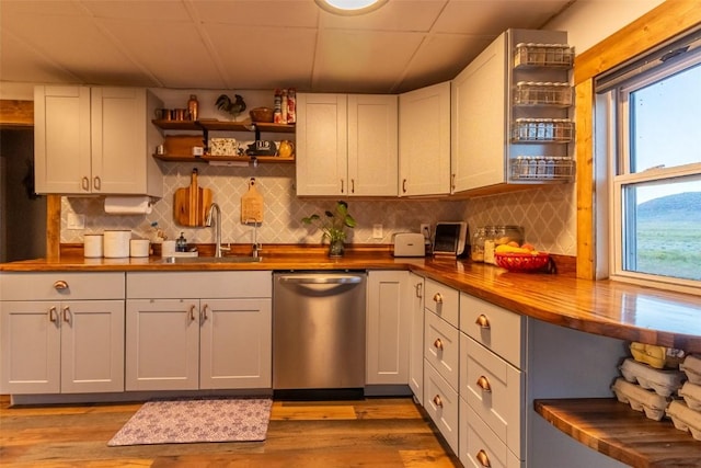 33685 State Highway 134, Toponas, CO 80479 - kitchen with stainless steel dishwasher, open shelves, butcher block countertops, and tasteful backsplash