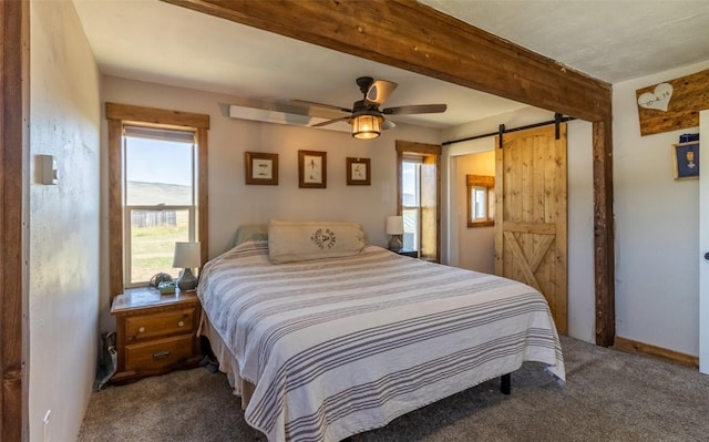 33685 State Highway 134, Toponas, CO 80479 - bedroom featuring dark carpet, a barn door, beam ceiling, and ceiling fan