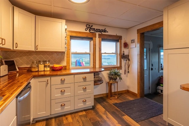 33685 State Highway 134, Toponas, CO 80479 - kitchen featuring wooden counters, dishwasher, dark wood-style floors, decorative backsplash, and a drop ceiling