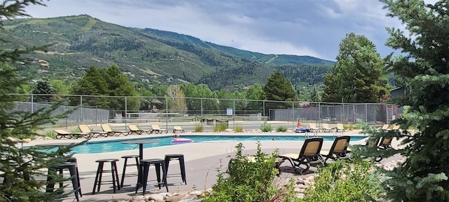 1335 Sparta Plz Unit 7, Steamboat Springs, CO 80487 - community pool featuring a mountain view and a patio