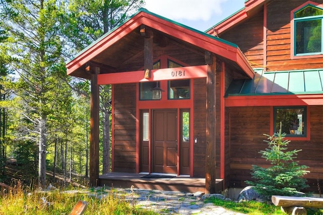 181 Red Fox Ct, Breckenridge, CO 80424 - view of exterior entry featuring a standing seam roof and metal roof