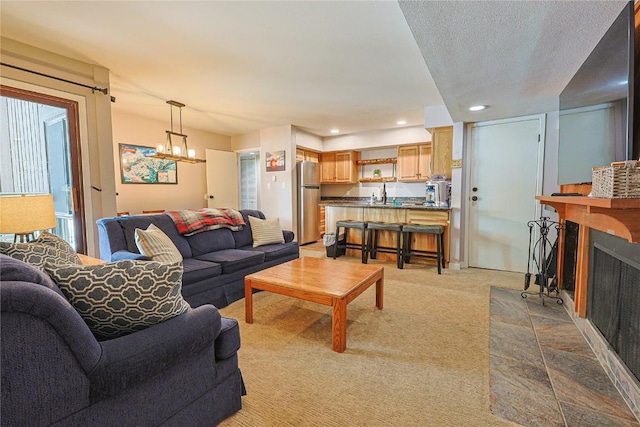 373 Wild Irishman Rd Unit 1071, Keystone, CO 80435 - carpeted living area featuring a fireplace, a chandelier, and recessed lighting