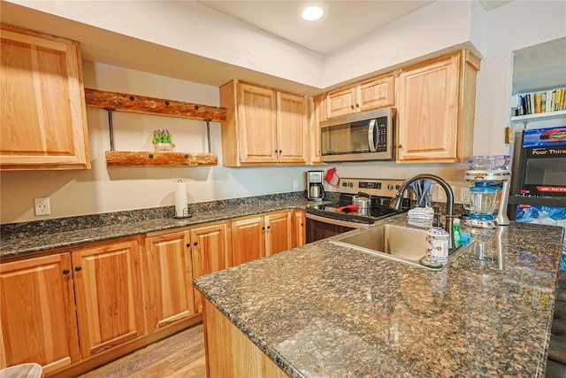 373 Wild Irishman Rd Unit 1071, Keystone, CO 80435 - kitchen featuring stainless steel appliances, dark stone countertops, open shelves, light brown cabinetry, and light wood-style flooring