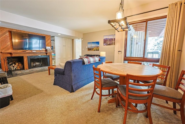 373 Wild Irishman Rd Unit 1071, Keystone, CO 80435 - carpeted dining room with a fireplace and a chandelier