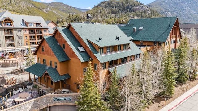 91 River Run Rd Unit 8117, Keystone, CO 80435 - rear view of property featuring board and batten siding, a shingled roof, and a mountain view