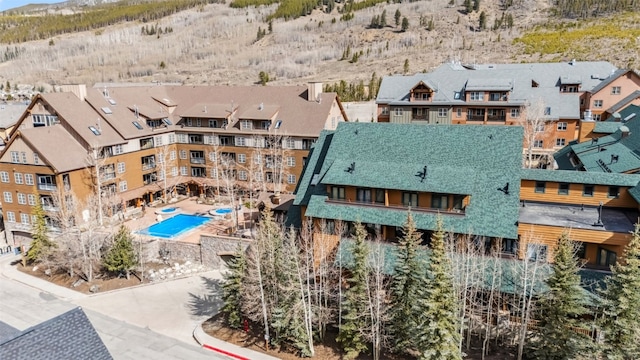 91 River Run Rd Unit 8117, Keystone, CO 80435 - aerial view of residential area with a mountain backdrop and a pool