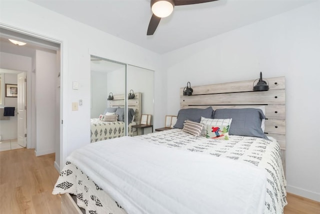 1565 Shadow Run Frontage Unit 103, Steamboat Springs, CO 80487 - bedroom with light wood-style flooring, a closet, baseboards, and ceiling fan