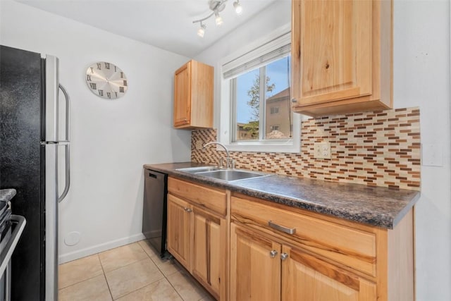 1565 Shadow Run Frontage Unit 103, Steamboat Springs, CO 80487 - kitchen with a sink, black dishwasher, freestanding refrigerator, and dark countertops