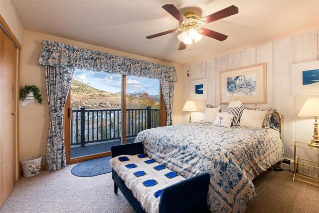 carpeted bedroom featuring a closet, access to exterior, and a ceiling fan