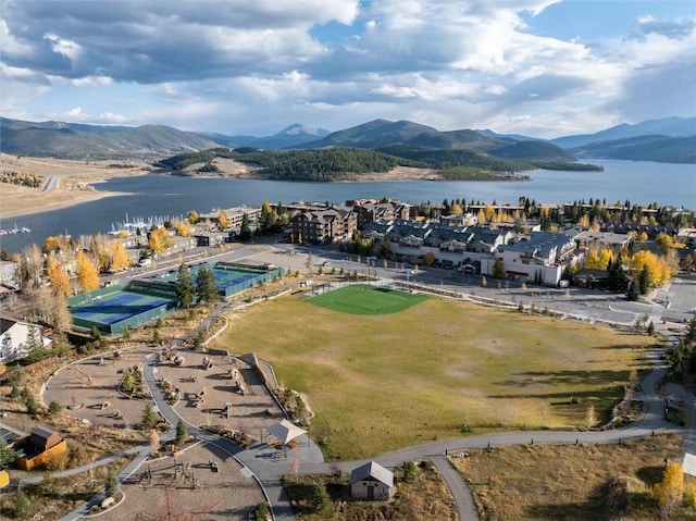 drone / aerial view with a water and mountain view