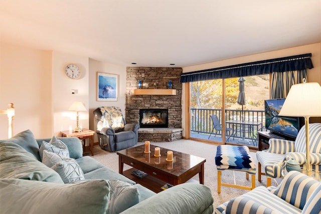 living room featuring carpet flooring and a fireplace