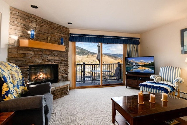 living area featuring carpet flooring and a fireplace