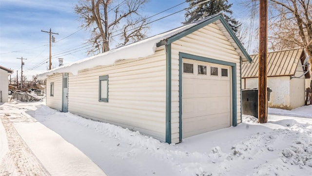 694 Russell St, Craig, CO 81625 - snow covered garage featuring a detached garage