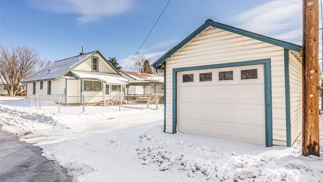 694 Russell St, Craig, CO 81625 - snow covered garage featuring a garage
