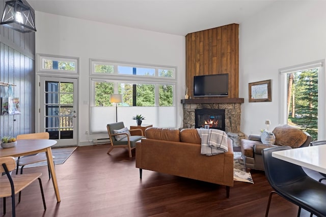100 N Gold Flake Ter Unit A, Breckenridge, CO 80424 - living area with a high ceiling, a stone fireplace, dark wood-type flooring, and healthy amount of natural light