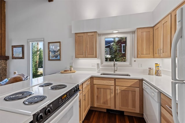 100 N Gold Flake Ter Unit A, Breckenridge, CO 80424 - kitchen with white appliances, light countertops, a high ceiling, dark wood-style flooring, and a peninsula