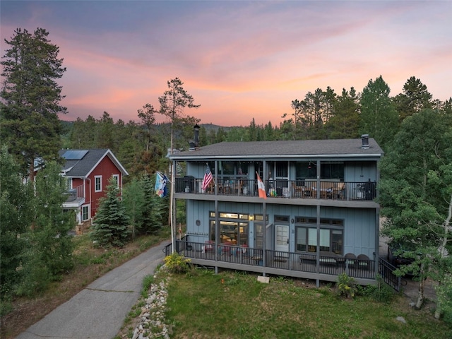 100 N Gold Flake Ter Unit A, Breckenridge, CO 80424 - back of house at dusk featuring a balcony