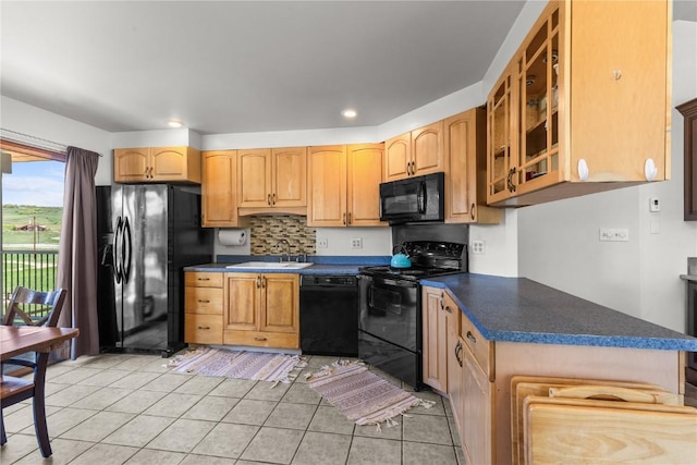 27358 Brandon Cir, Steamboat Springs, CO 80487 - kitchen with black appliances, a sink, light tile patterned flooring, dark countertops, and recessed lighting