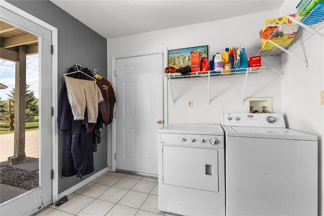 27358 Brandon Cir, Steamboat Springs, CO 80487 - washroom featuring washing machine and clothes dryer and light tile patterned floors