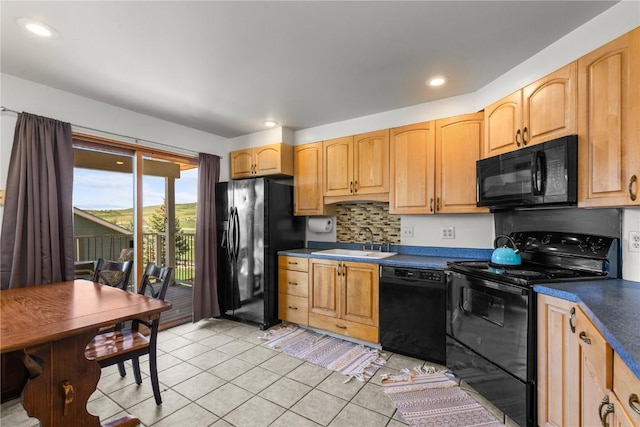 27358 Brandon Cir, Steamboat Springs, CO 80487 - kitchen with black appliances, a sink, light tile patterned floors, dark countertops, and backsplash