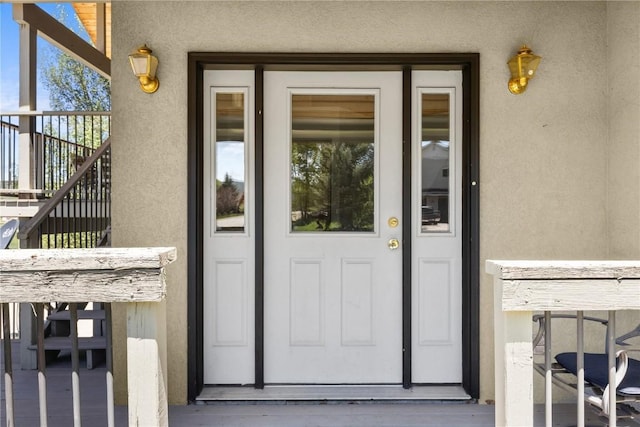27358 Brandon Cir, Steamboat Springs, CO 80487 - doorway to property featuring stucco siding