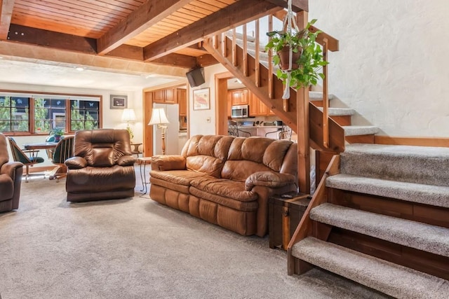 27125 Moonlight Way, Steamboat Springs, CO 80487 - living room with stairway, carpet flooring, and a wooden ceiling with exposed beams