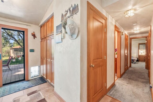 27125 Moonlight Way, Steamboat Springs, CO 80487 - foyer with light tile patterned flooring and lofted ceiling