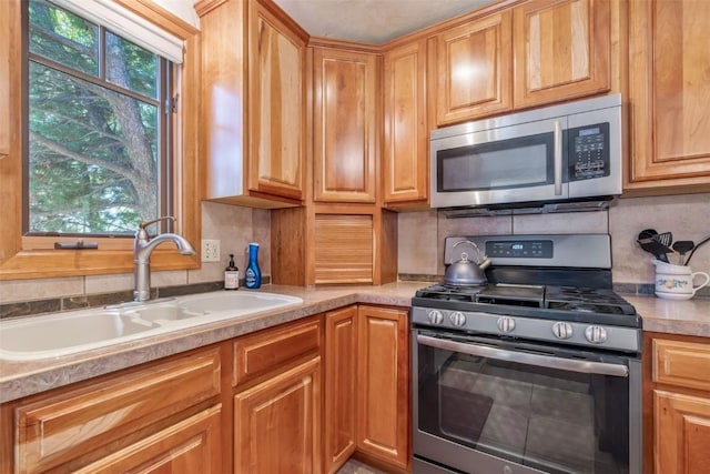 27125 Moonlight Way, Steamboat Springs, CO 80487 - kitchen with appliances with stainless steel finishes, tasteful backsplash, and light countertops