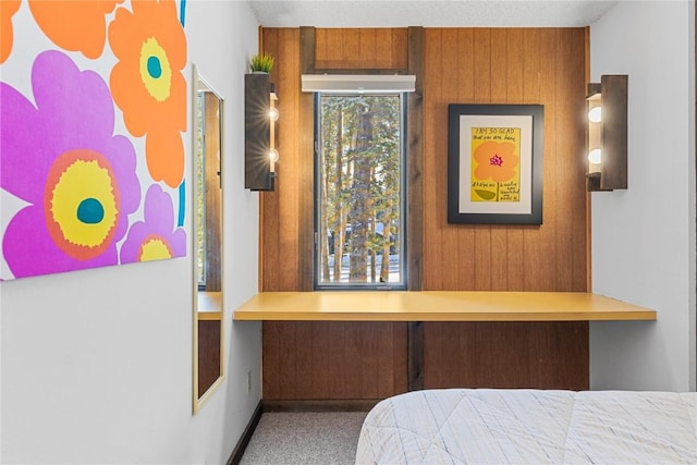 1140 Ski Hill Rd Unit 25, Breckenridge, CO 80424 - bedroom featuring wooden walls and carpet