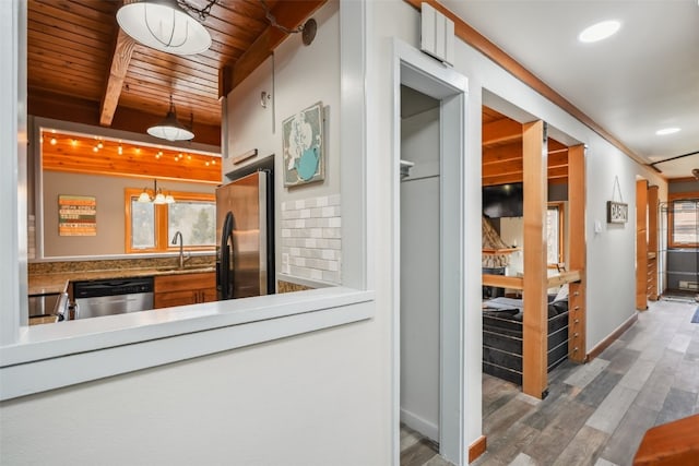 530 Tennis Club Rd Unit 1328, Keystone, CO 80435 - interior space featuring a sink, wood ceiling, plenty of natural light, and wood finished floors