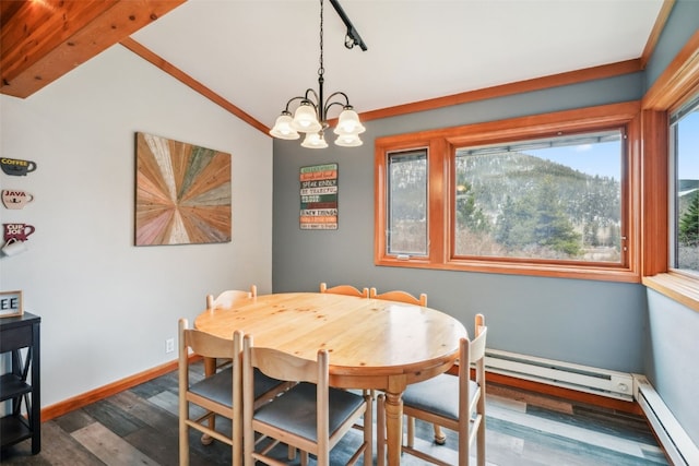 530 Tennis Club Rd Unit 1328, Keystone, CO 80435 - dining area with an inviting chandelier, lofted ceiling, wood finished floors, a baseboard heating unit, and a baseboard radiator