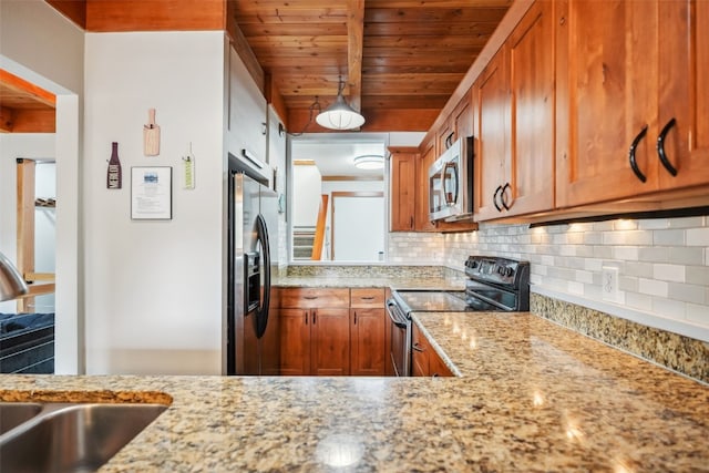 530 Tennis Club Rd Unit 1328, Keystone, CO 80435 - kitchen featuring decorative backsplash, stainless steel appliances, brown cabinetry, and a sink
