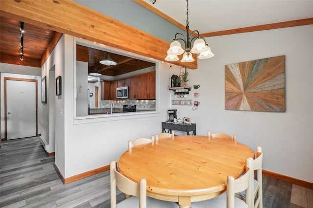 530 Tennis Club Rd Unit 1328, Keystone, CO 80435 - dining space with wood finished floors, baseboards, a chandelier, wooden ceiling, and rail lighting