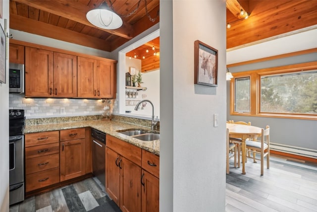 530 Tennis Club Rd Unit 1328, Keystone, CO 80435 - kitchen with decorative backsplash, a sink, light stone counters, stainless steel appliances, and dark wood-type flooring